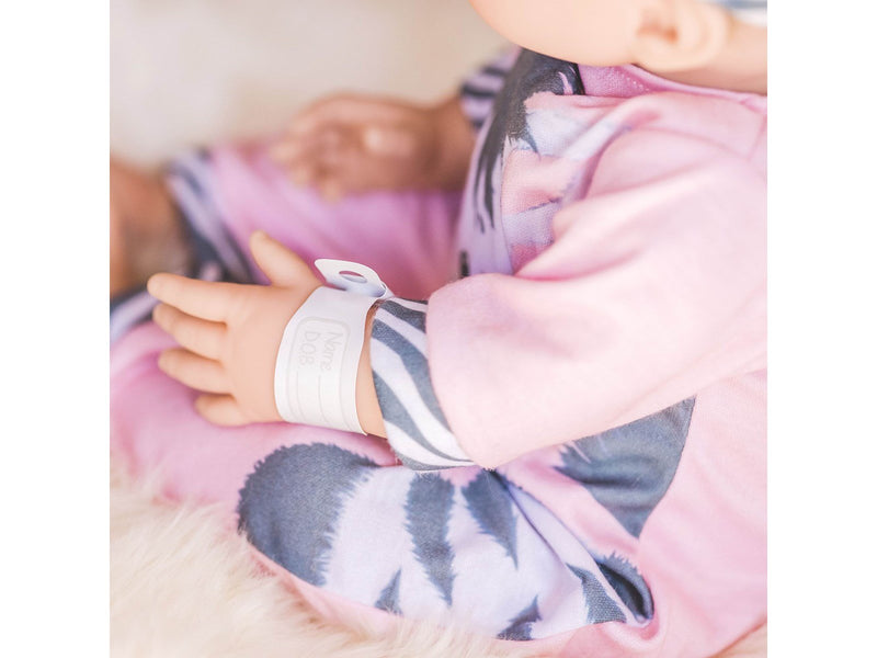 Tiny Treasures Doll with blond hair and Zebra outfit.