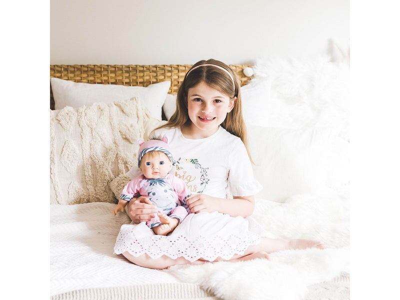 Tiny Treasures Doll with blond hair and Zebra outfit.