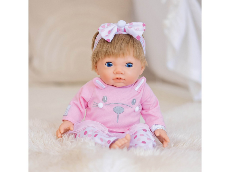 Tiny Treasures Doll with blonde hair and pink outfit